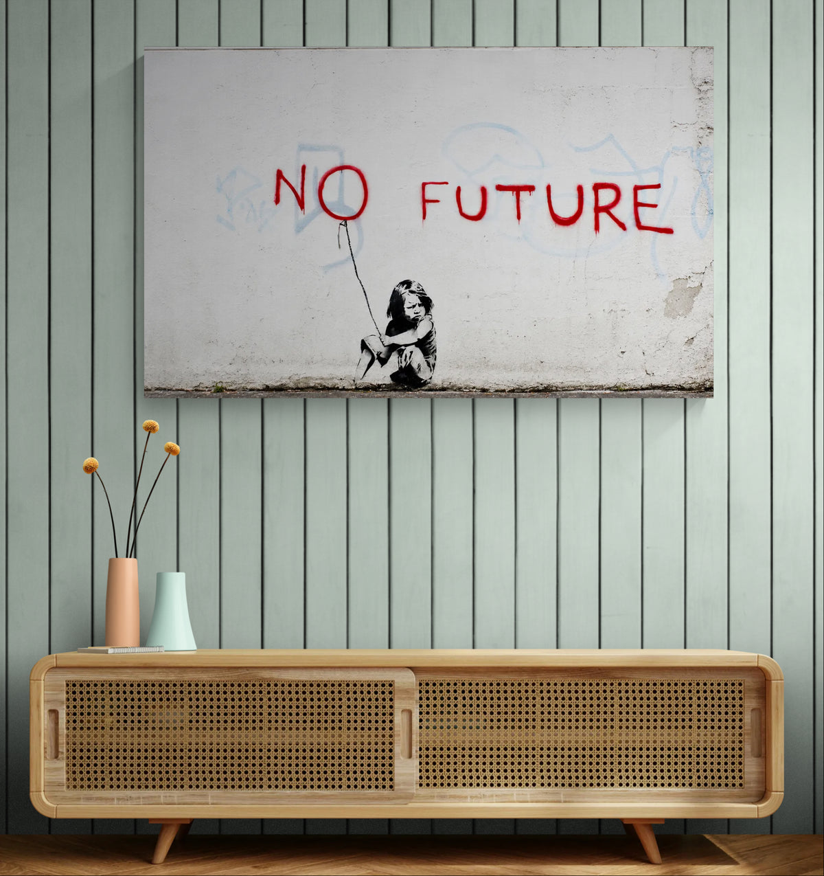 Banksy No Future graffiti canvas displayed on a natural wood-panelled wall beside a potted plant